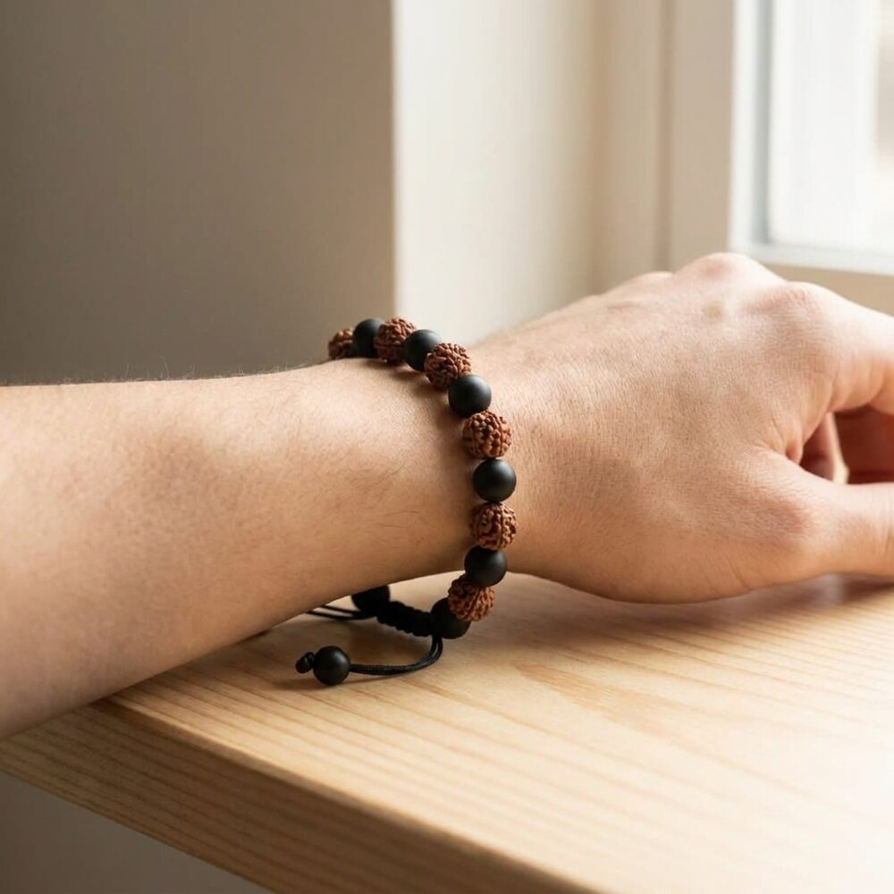 Rudraksh Black Onyx Bracelet worn on wrist lifestyle photo on wood surface with natural light