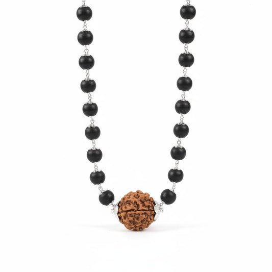 Necklace with karungali beads and a large brown rudraksha bead on a white background
