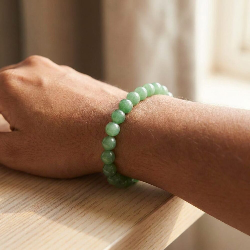 Green Aventurine Bracelet worn on wrist lifestyle photo on wood surface with natural light