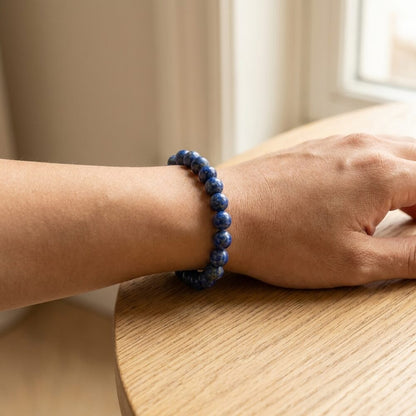 Lapis Lazuli Bracelet worn on wrist lifestyle photo on wood surface with natural light
