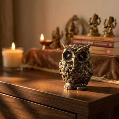 Pyrite Owl Figurine lifestyle photo on wood altar shelf with warm diya candlelight - Vastu Feng Shui wisdom and wealth symbol
