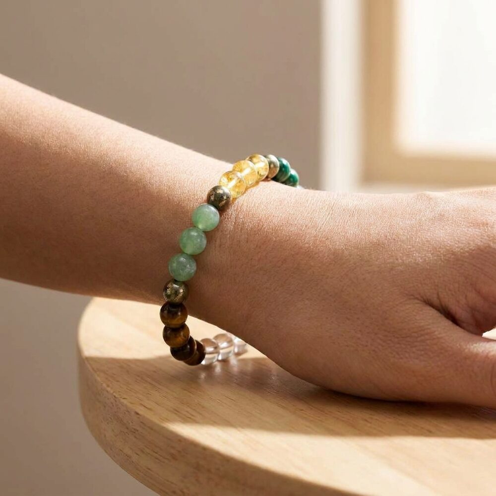 Dhan Labh Bracelet worn on wrist lifestyle photo on wood surface with natural light - wealth and prosperity bracelet