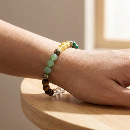 Dhan Labh Bracelet worn on wrist lifestyle photo on wood surface with natural light - wealth and prosperity bracelet