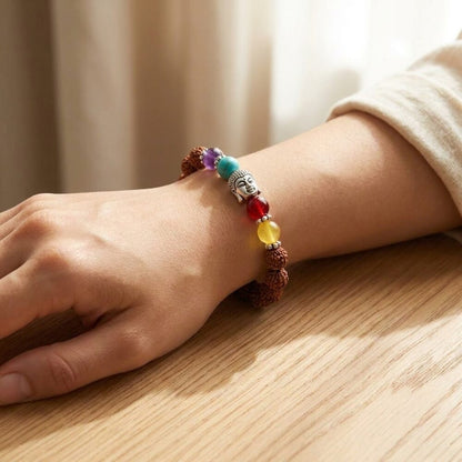 7 Chakra Rudraksh Bracelet worn on wrist lifestyle photo on wood surface with natural light