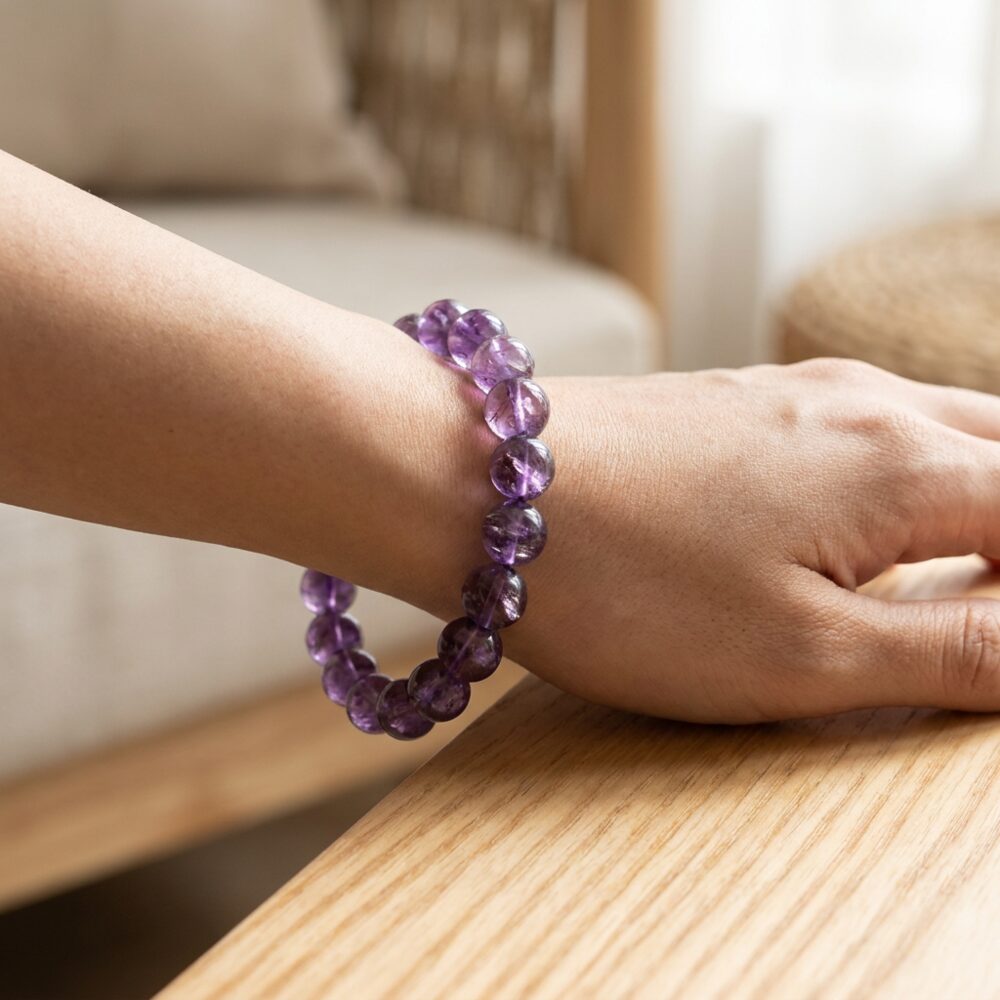 Amethyst Crystal Bracelet worn on wrist lifestyle photo on wood surface with natural light