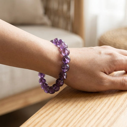 Amethyst Crystal Bracelet worn on wrist lifestyle photo on wood surface with natural light