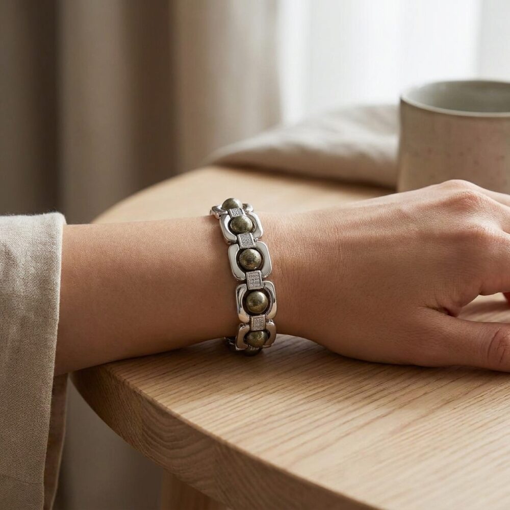 Silver Plated Pyrite Bracelet worn on wrist lifestyle photo on wood surface with natural light