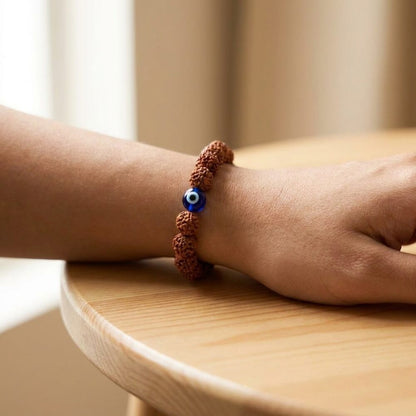 5 Mukhi Rudraksh Nazar Raksha Bracelet worn on wrist lifestyle photo on wood surface with natural light